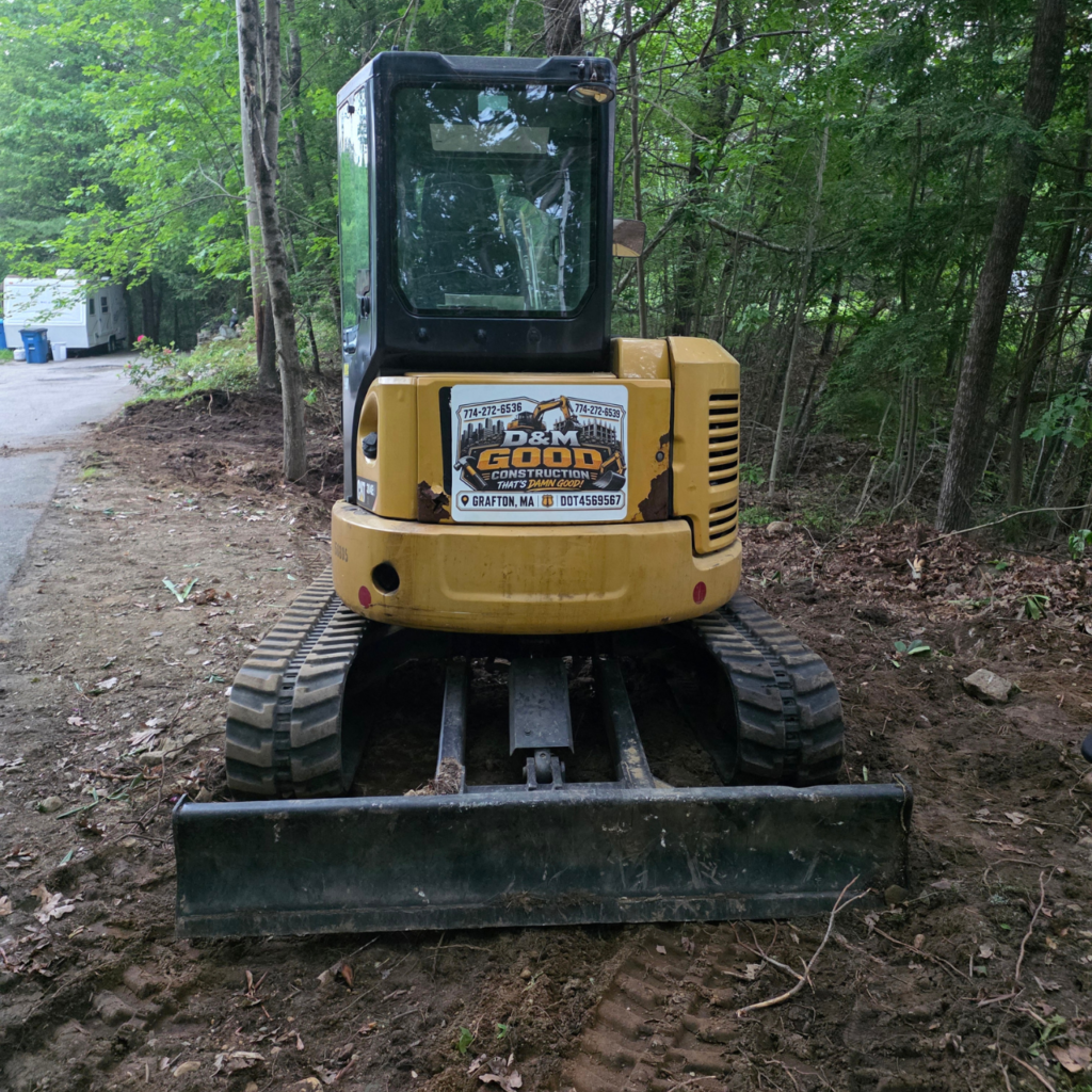 Mini excavator used for land clearing and property improvement services