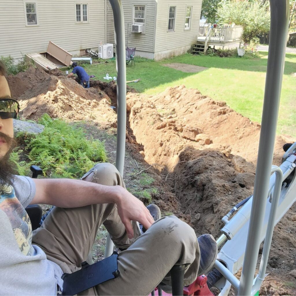 Foundation excavation in Central Massachusetts alongside an existing house