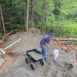 Backfilling and compaction placing fill in lifts on a Central Massachusetts property