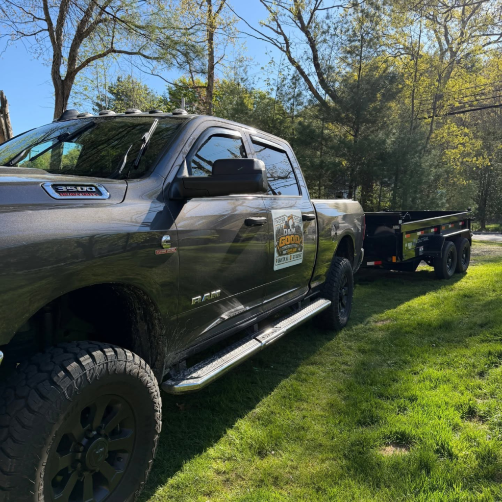 Material hauling and removal truck and dump trailer at a Central Massachusetts property