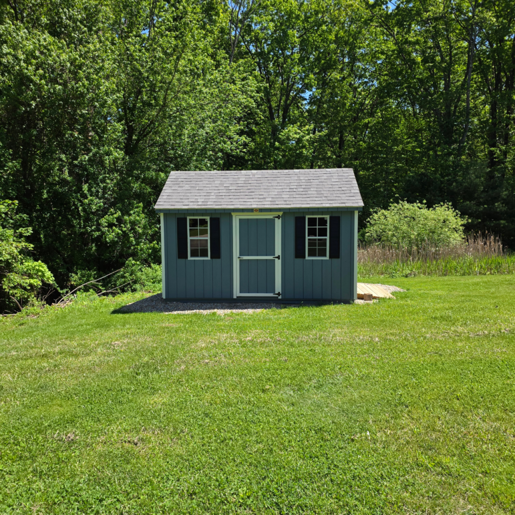 Shed pad installation finished with a shed set on a compacted gravel pad in Central Massachusetts