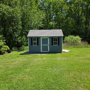 Shed pad installation finished with a shed set on a compacted gravel pad in Central Massachusetts